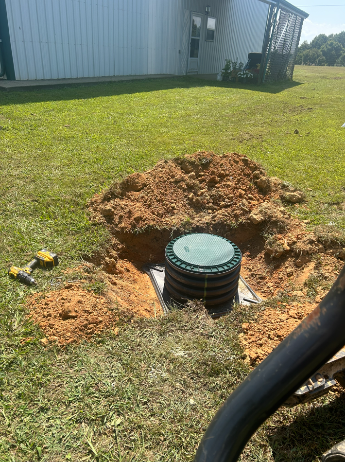 Septic riser installation before the yard was restored
