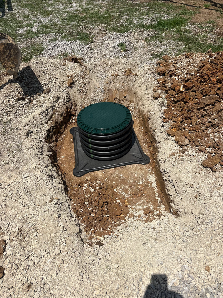 New septic tank riser installed and ready for backfilling